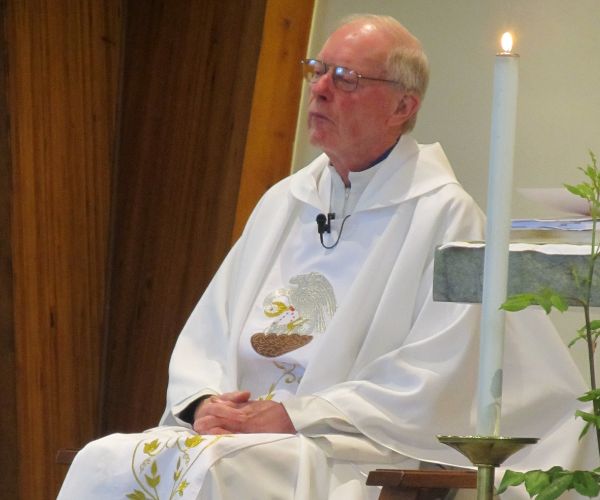 A photo of Fr Bernard Charnock during Mass