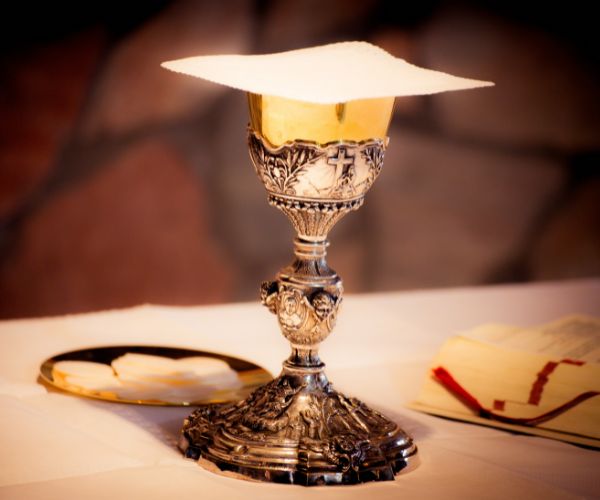 A chalice and paten with wafers