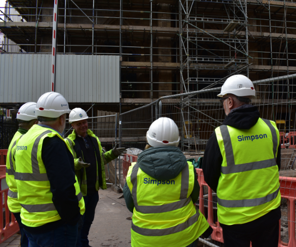 Site Manager for Cathedral restoration project speaking to visitors during cathedral tour