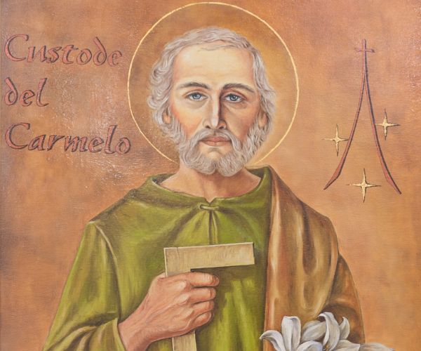 Image of St Joseph holding a carpentry tool