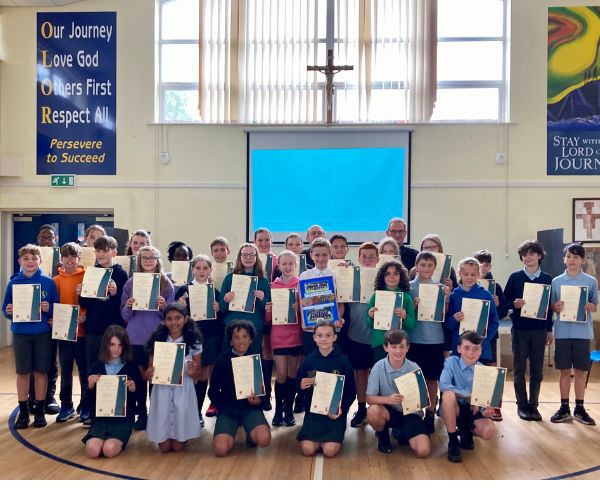 Year Six pupils from Our Lady of the Rosary Primary School stand for a group photo with their certificates