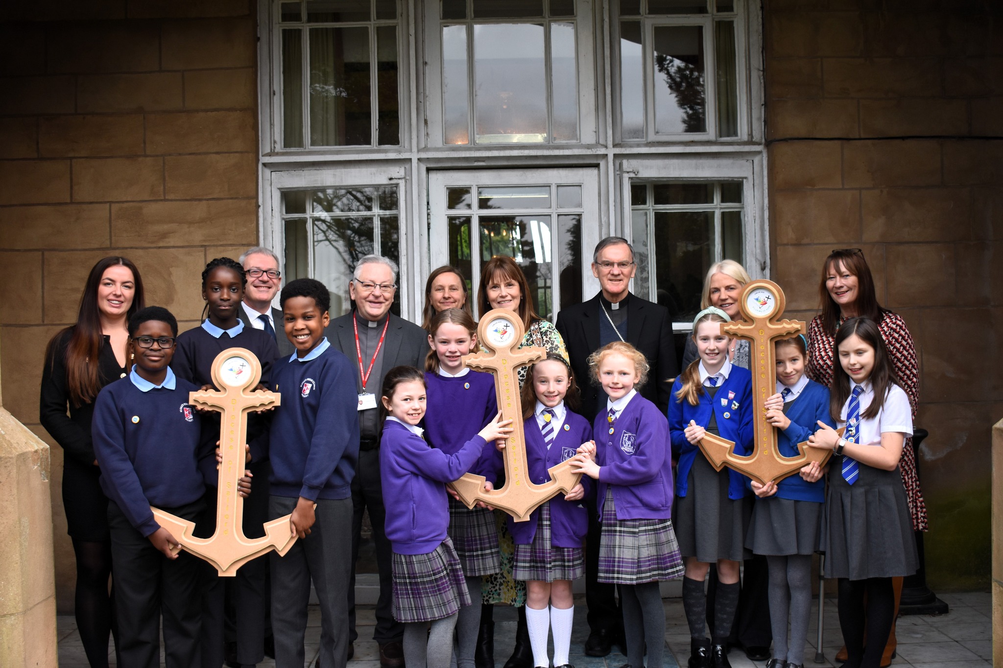 Pupils and staff from schools in each of our Academy Trusts proudly display their anchors with Bishop John and our Jubilee Coordinator, Fr Chris Lough